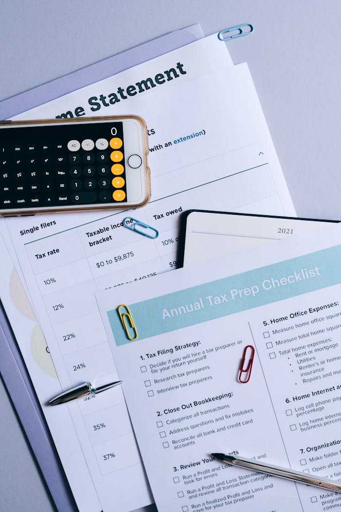 services-02 Flat lay of financial documents, tax checklist, and calculator for tax prep.