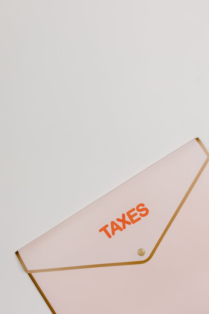 about-01 A simple and elegant image of a taxes labeled envelope on a white background, perfect for financial themes.